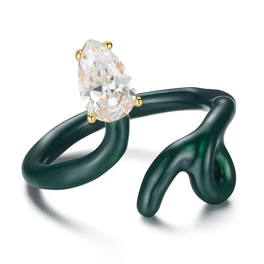 Green and white abstract ring