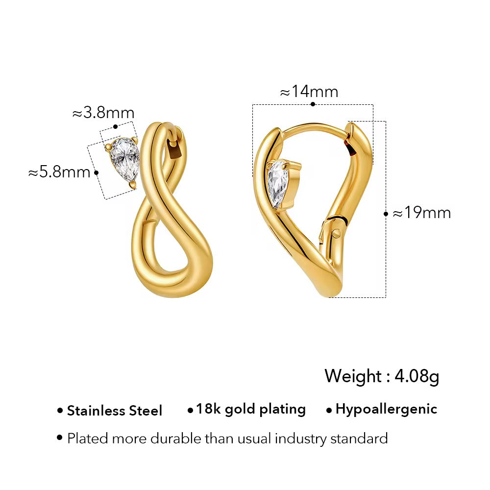 Abstract gold earring with gem