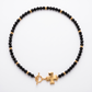 Black and gold cross necklace