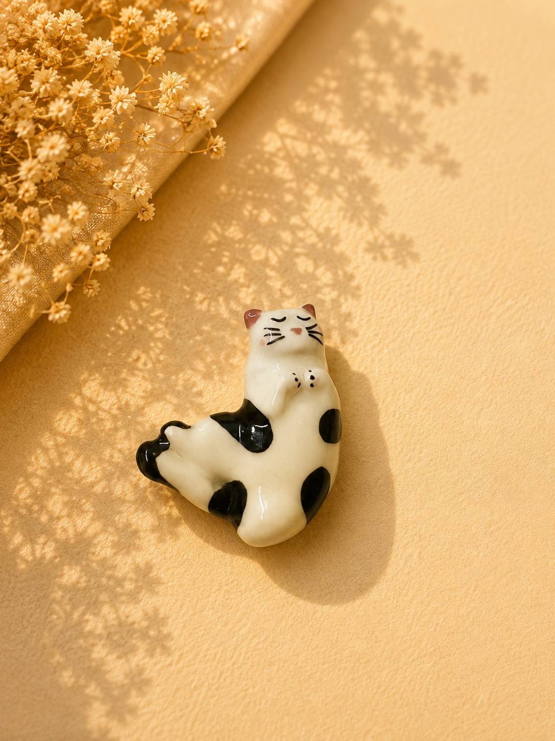 Lounging Spotted Cat Ceramic Brooch